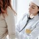 Nurse giving checkup to a woman